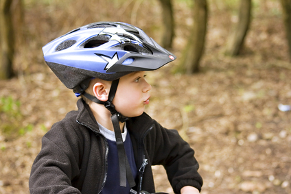 child wearing a bicycle helmet
